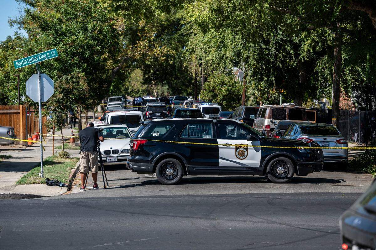 Sacramento police investigate the shooting death of an unidentified man on Sixth Avenue in Oak Park on Tuesday. The man drove himself to UC Davis Medical Center, where he died, according to police.