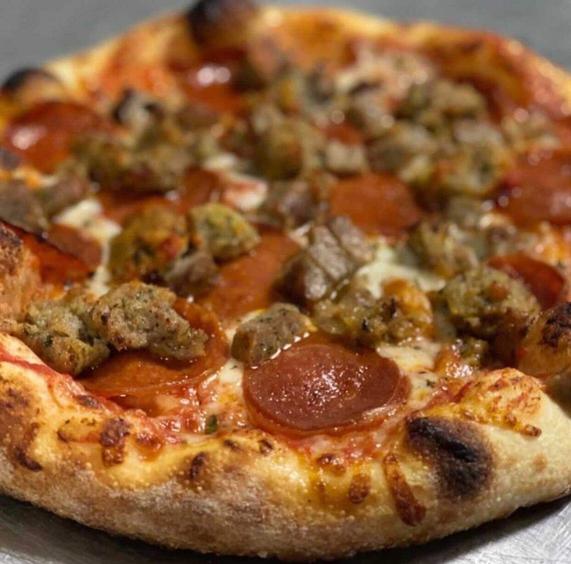 A pepperoni and sausage pizza made at Giovanni’s Old World New York Pizzeria, a New York style pizza shop in Sacramento.