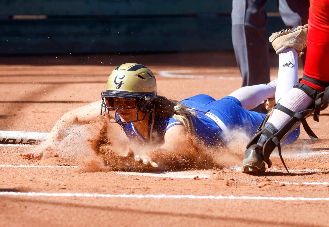 Capital Christian’s McKayla Fulmer dives into home against Willow Glen in the first inning of the CIF Northern California Division I softball championship game at Willow Glen High School in San Jose on Saturday, June 1, 2024.