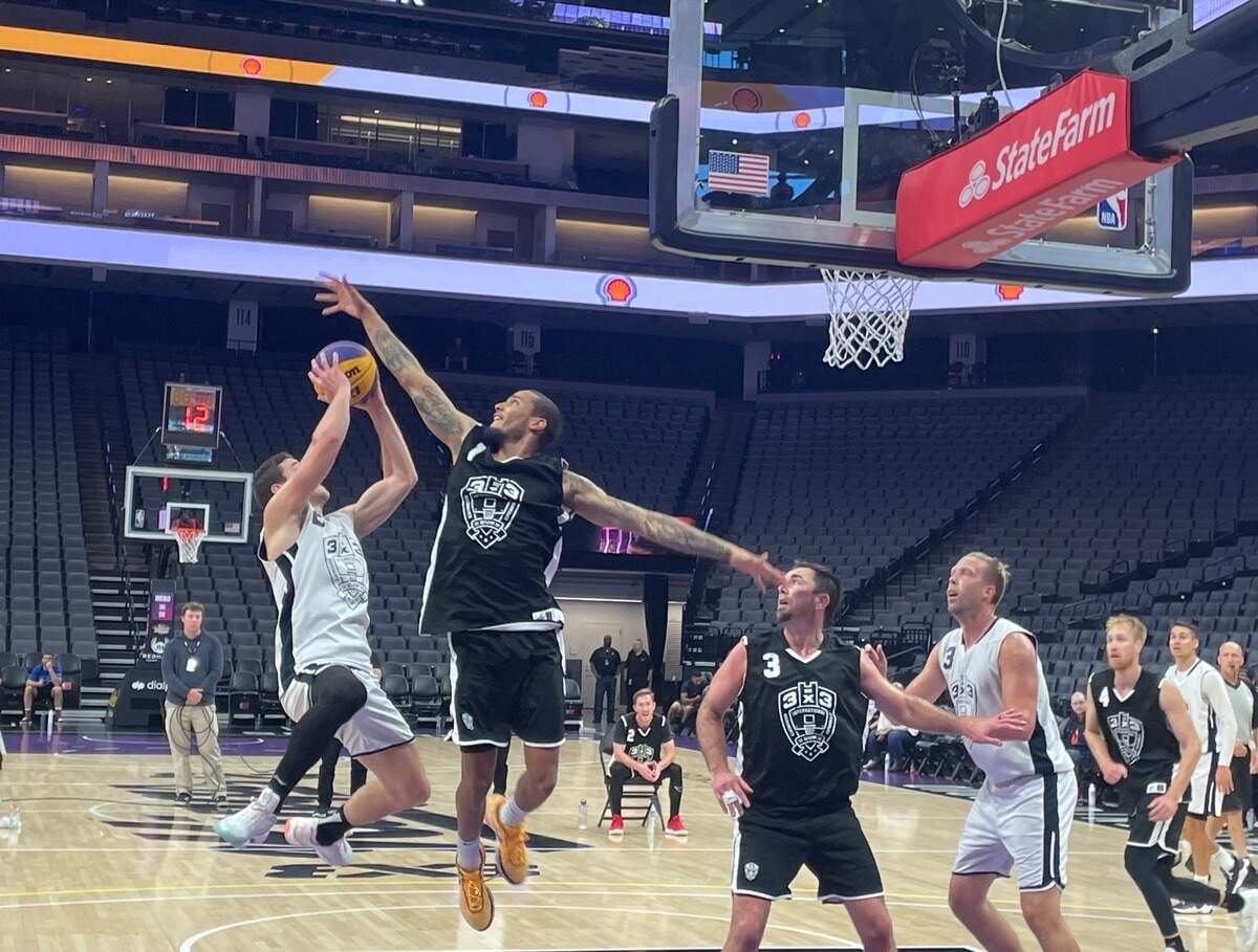 Former Sacramento Kings guard Jimmer Fredette hangs in the air for Team Miami to make a tough bankshot over James Parrott of Team Omaha on Sunday, Oct. 1.