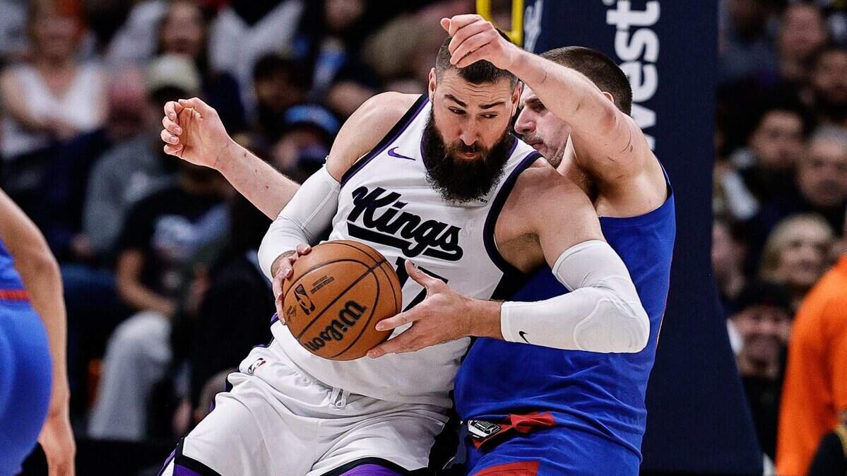 Mar 5, 2025; Denver, Colorado, USA; Sacramento Kings center Jonas Valanciunas (17) knocks Denver Nuggets center Nikola Jokic (15) to the court in the second quarter at Ball Arena. Mandatory Credit: Isaiah J. Downing-Imagn Images