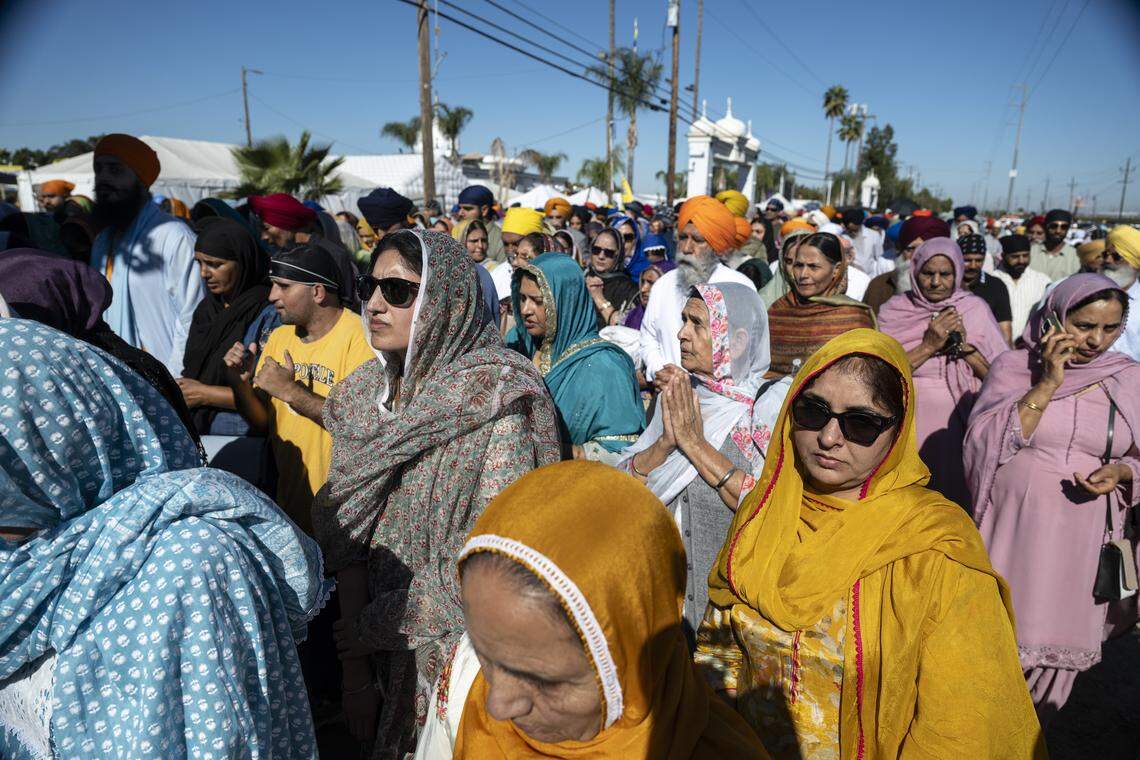 Members of the Sikh community follow the main float during Nagar Kirtan, also known as the Sikh Parade, in Sutter County on Sunday.