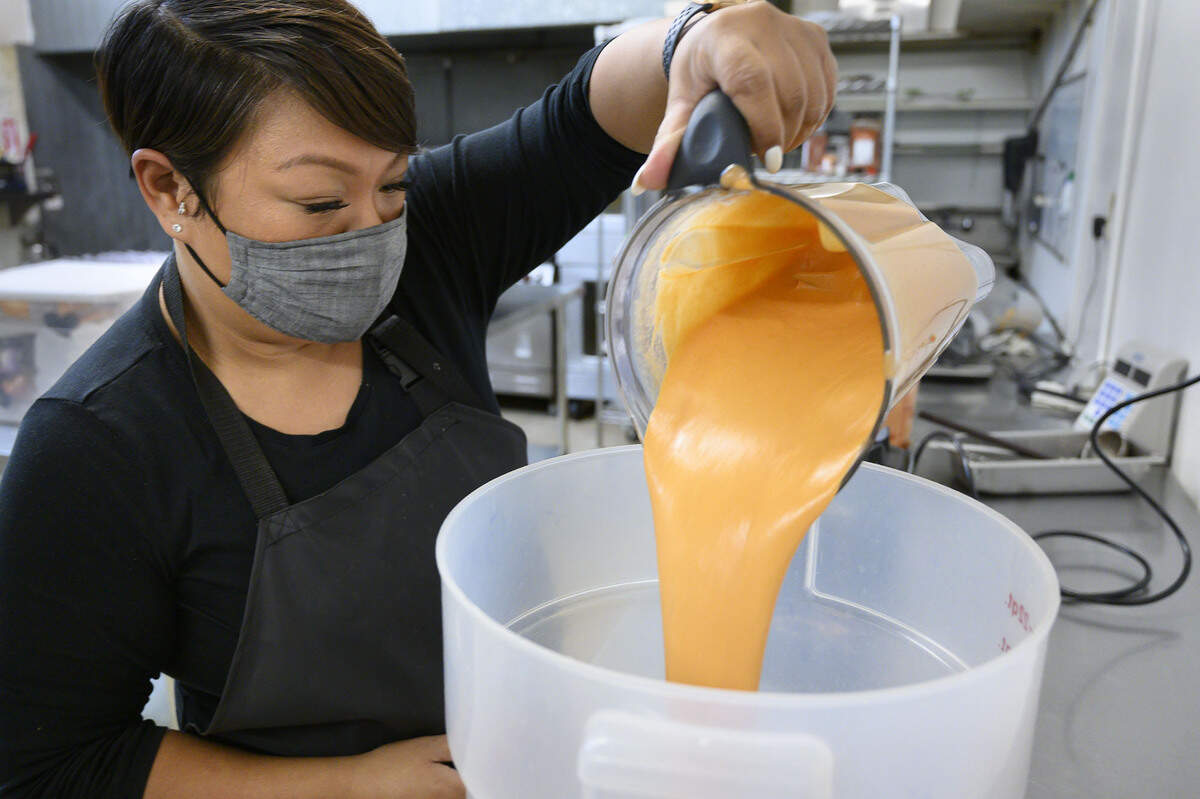 Jasmine Bonilla of North Natomas pours her finely-blended ingredients into a five-gallon bucket before she bottles a batch of her Jazz’s Spicy Sauce at Alchemist Kitchen in Sacramento on Tuesday, Dec. 14. Alchemist CDC is asking Book of Dreams readers for donations to help purchase a commercial freezer and industrial food processor for shared at their kitchen space.