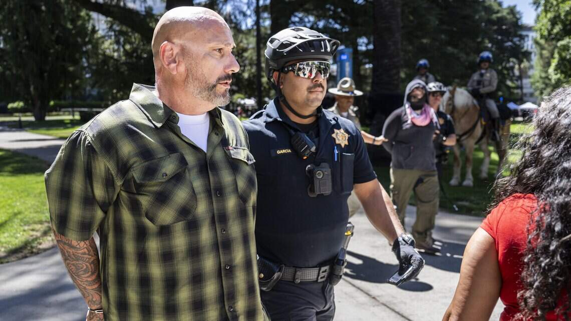 Photos: See people detained after scuffle erupts at Nick Shirley rally at CA Capitol