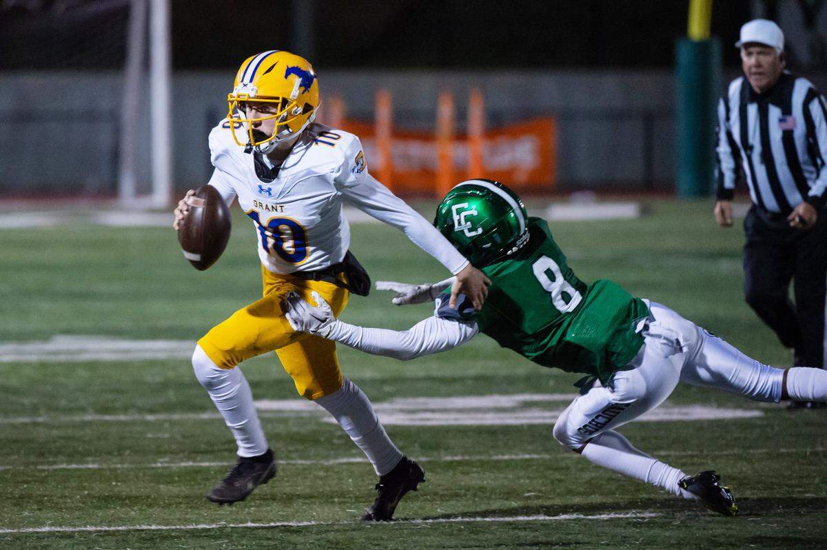El Cerrito Gauchos Christian White (8) dives to tackle Grant Pacers quarterback JoJo McCray (10) during the CIF Division III-AA state regional finals game in December.