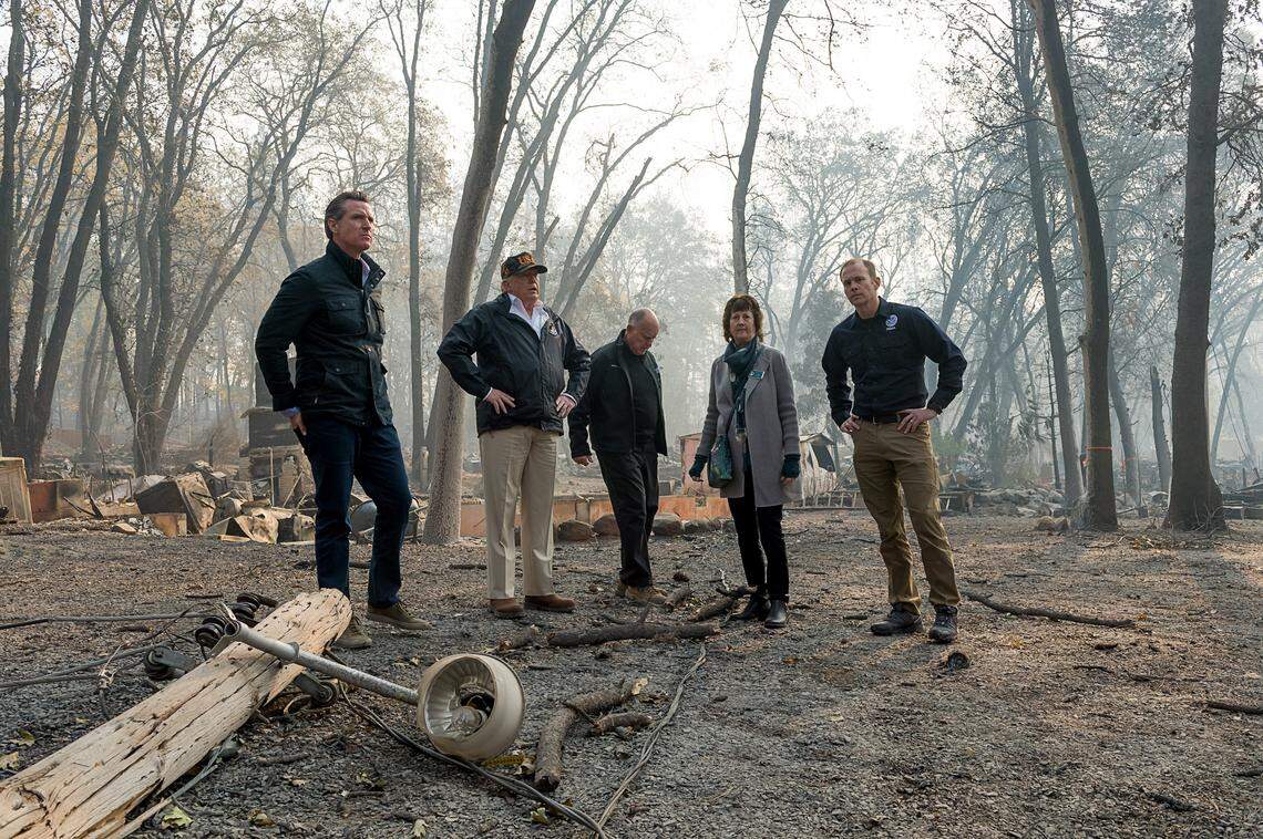 Gov.-elect Gavin Newson, FEMA Director Brock Long, President Donald Trump, Paradise mayor Jody Jones and Gov. Jerry Brown tour the Skyway Villa Mobile Home and RV Park during Trump’s visit of the Camp Fire in Paradise on Saturday, November 17.