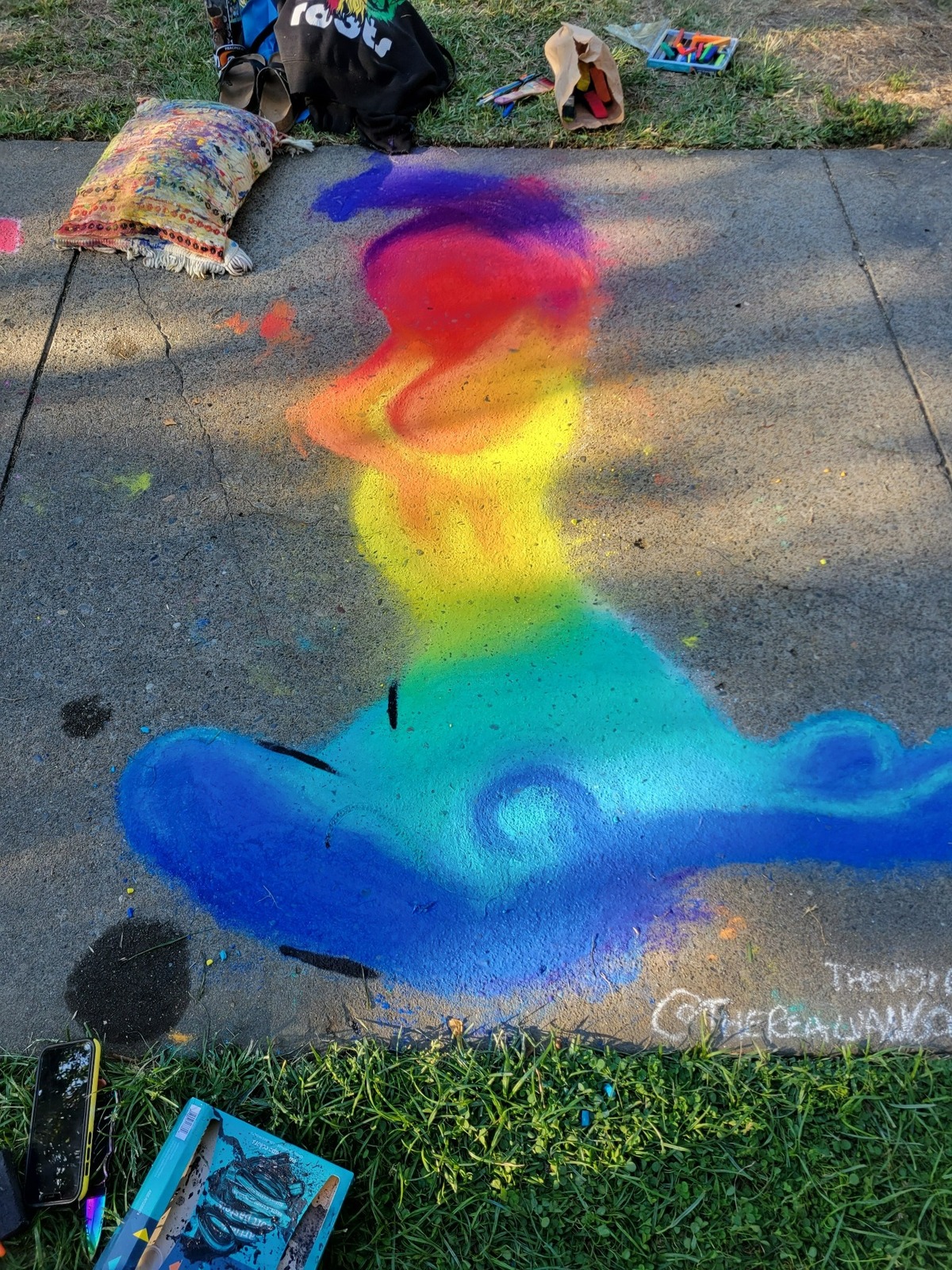 Veronica Tate’s unfinished chalk art appears on a sidewalk outside Fremont Park in Sacramento on Sunday, Sept. 4, 2022.