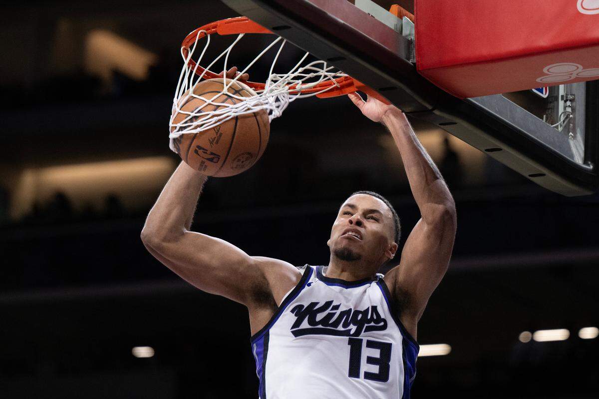 Sacramento Kings forward Keegan Murray (13) scores a basket in the second half in an NBA game against the Portland Trail Blazers on Thursday, March 27, 2025 at Golden 1 Center.