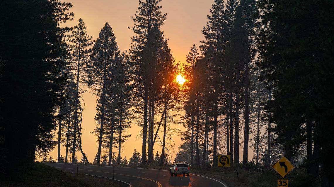 The sun shines through smoke from the Park Fire east of Chico on Highway 32 on Tuesday, July 30, 2024.