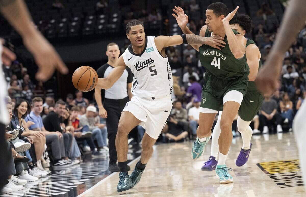 Sacramento Kings guard Darius Acuff Jr. (5) drives the ball down the court during the California Classic game against the Milwaukee Bucks at Golden 1 Center on Monday.