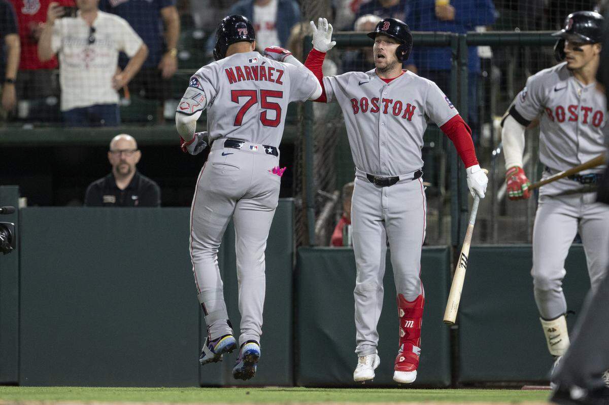 Boston Red Sox catcher Carlos Narváez (75) and his teammate react after scoring during a game between the Athletics and the Red Sox at Sutter Health Park in West Sacramento on Monday, Sept. 8, 2025.