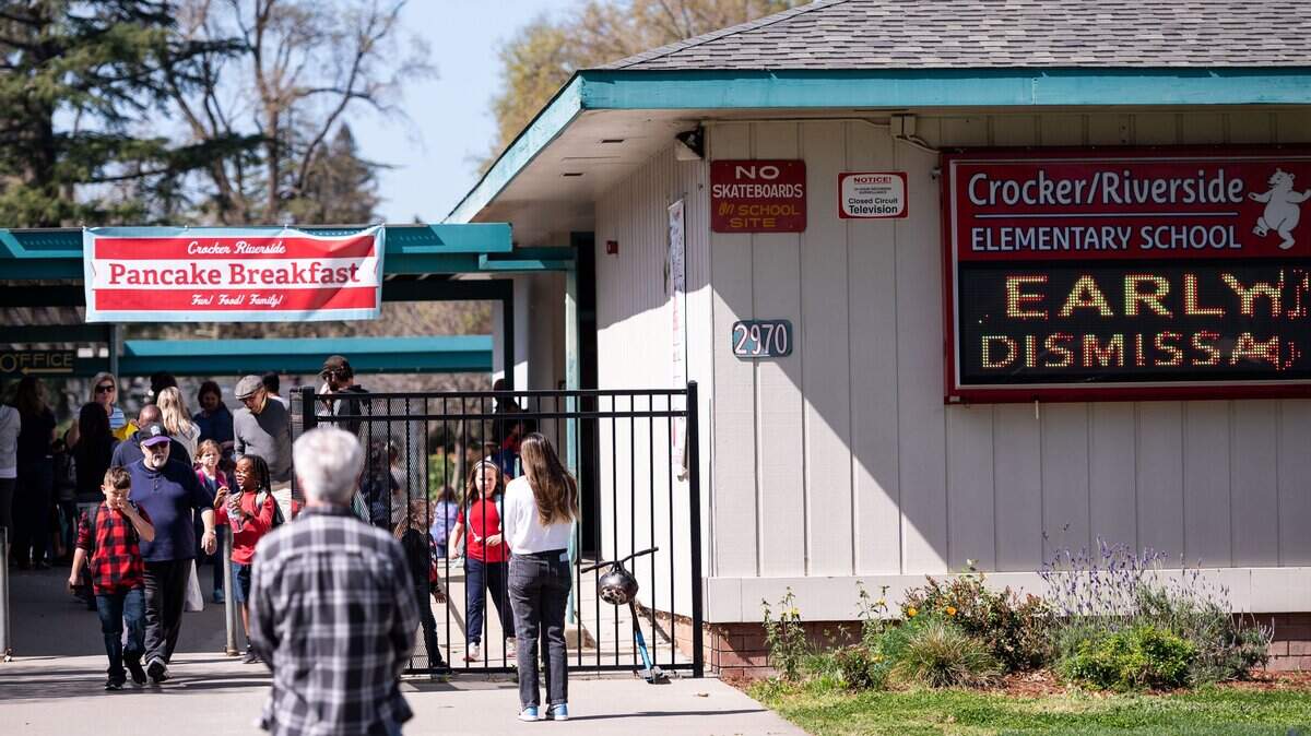 Students at Crocker/Riverside Elementary in Sacramento are released from school on Friday, March 13, 2020.