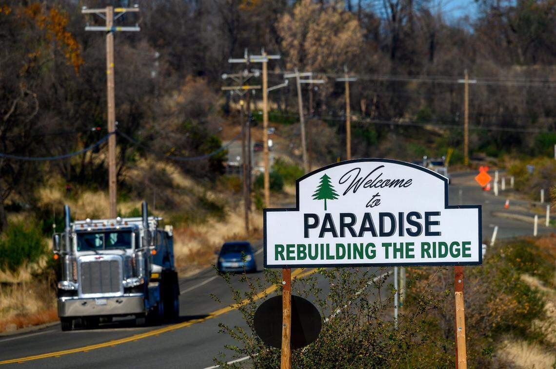 A welcome sign along Clark Street reminds drivers of the rebuilding of the ridge in 2019, after the Camp Fire in Paradise.