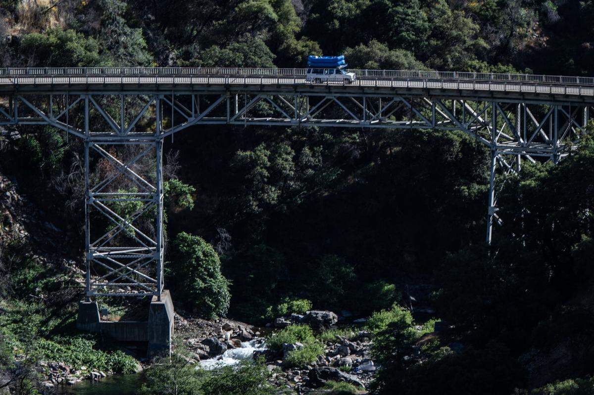 A van with Whitewater Excitement travels on Mosquito Ridge Road to take rafters to the Middle Fork of the American River on Sunday, June 2, 2024.
