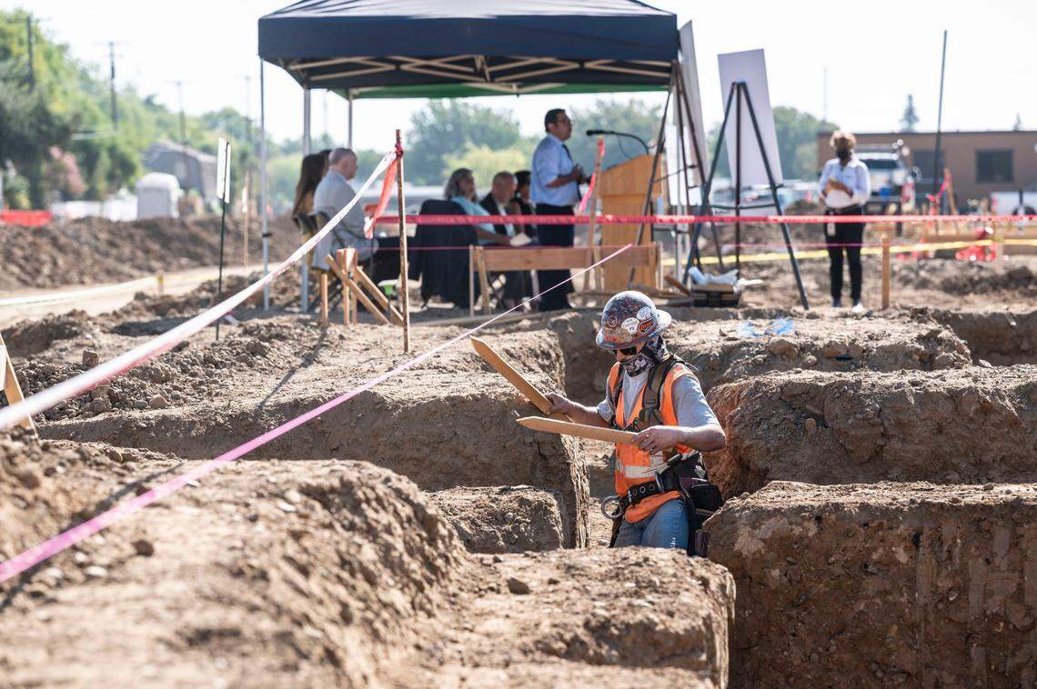 Alex Alvarez, of Conco, walks inside a construction area on Aug. 18 where the Mercy Housing project is being built on Stockton Boulevard. When completed, the development will have a total of 200 new homes.