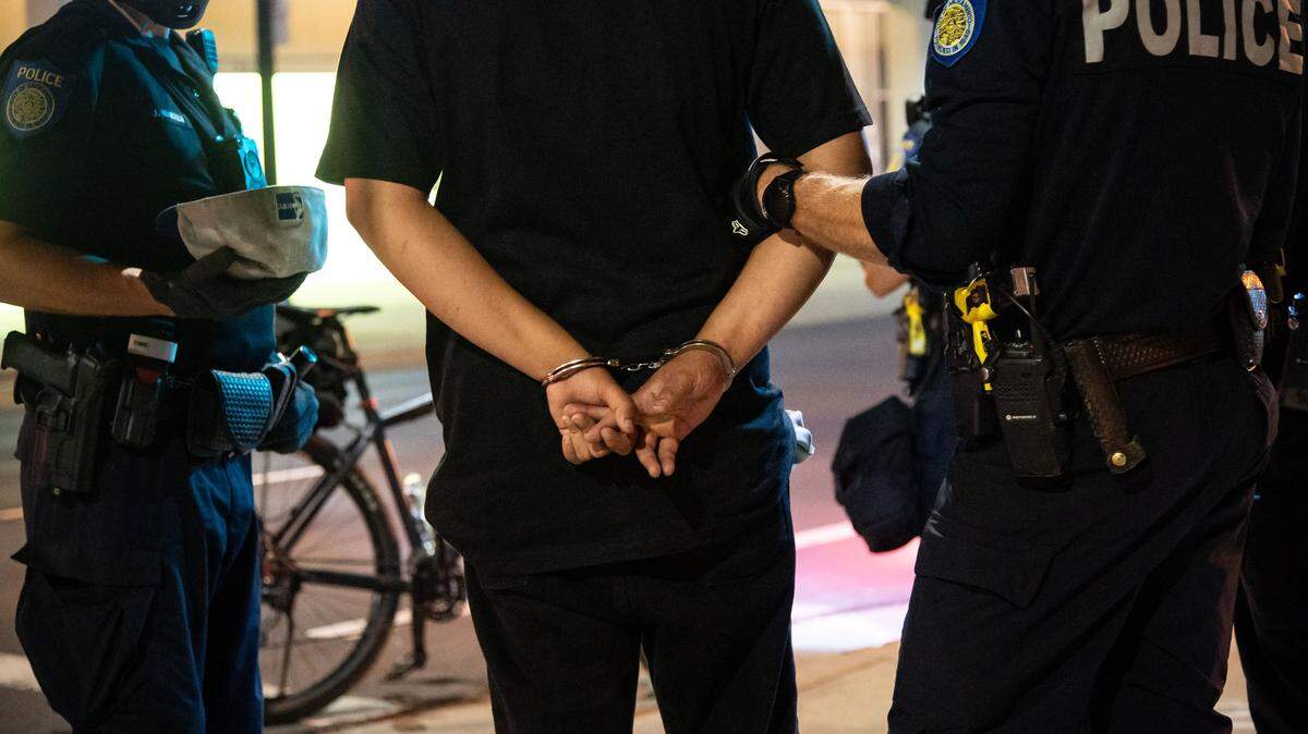 A man is detained for curfew violation at 10th and I streets after demonstrations against police brutality and racism ended for the day Tuesday, June 2, 2020, in Sacramento after George Floyd was killed by Minneapolis police last week, sparking civil unrest across the country.
