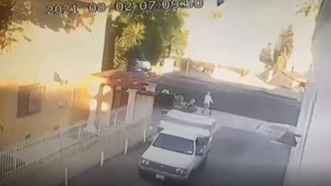 A pickup truck backed over a 91-year-old woman with a walker, then the driver stopped to check on her before fleeing, Los Angeles police say.