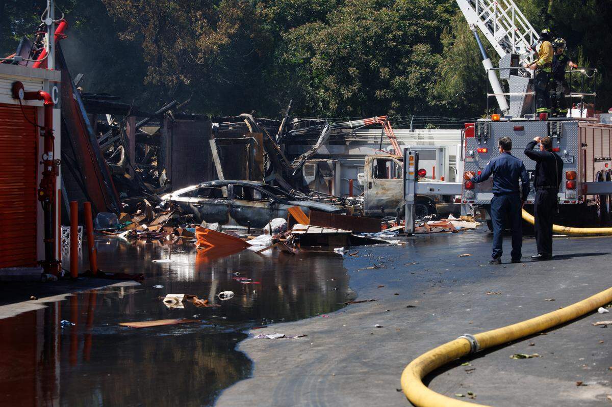The San Jose Fire Department remains on scene at the Public Storage facility in south San Jose on June 15, 2023, following a three-alarm fire that heavily damaged the business the night before. According to police, the fire was caused by illegal fireworks.