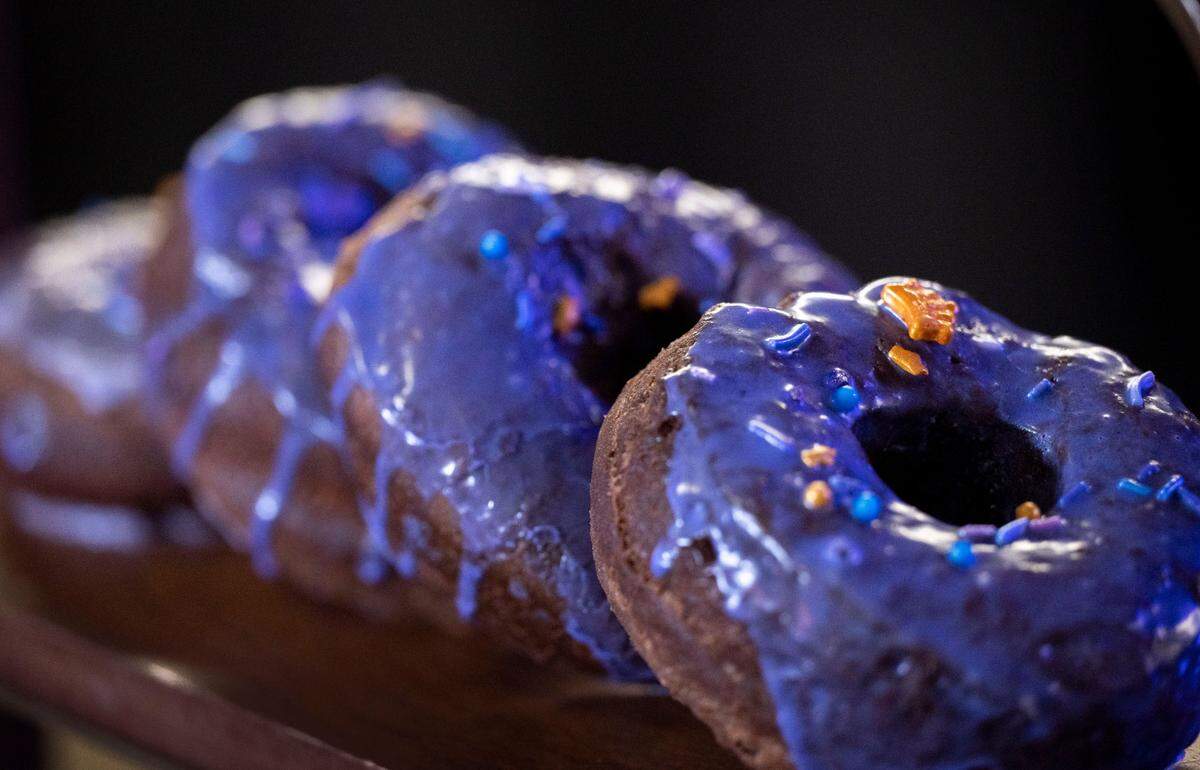 Kings Donuts from Sweet Bird have purple glaze with golden crown sprinkles at the Media Food Tasting at Golden 1 Center on Oct. 13 featuring new local menu items for the Sacramento Kings season.