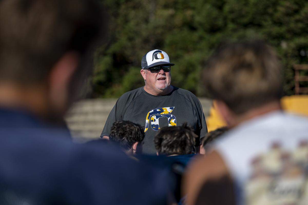 Head coach Casey Taylor speaks to his players after a football practice at Oak Ridge High School in El Dorado Hills on Tuesday, Aug. 5, 2025.