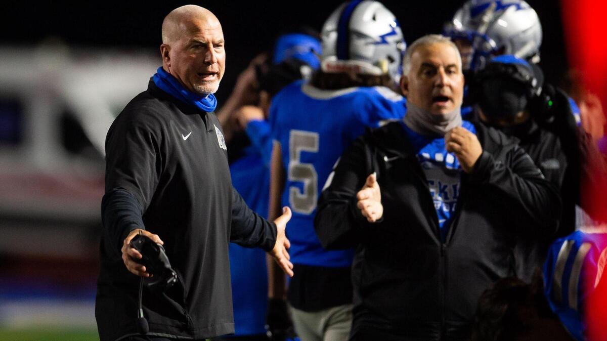Rocklin head coach Jason Adams controls the sideline during the second quarter of their high school football game against Del Oro on Friday, March 19, 2021, in Rocklin. Rocklin beat rival Del Oro 29-21.