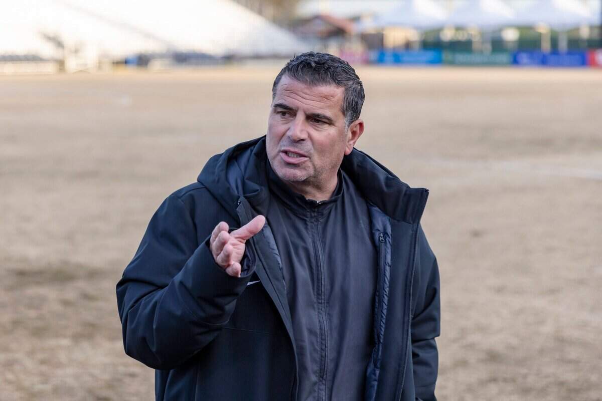 Oak Ridge Trojans coach Rino Chimienti talks with the team at halftime at the CIF Sac-Joaquin Division I girls soccer championship on Thursday at Heart Health Park in Sacramento. Oak Ridge won 8-1.