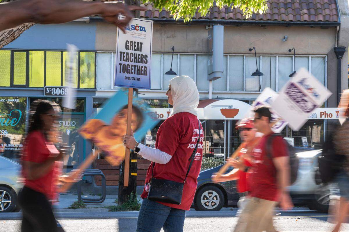 Tammy Abdo, a social science teacher at McClatchy High School. joins other Sacramento City Teachers Association members striking in front of her school on Wednesday, March 23, 2022. “I’m sad that we had to have a strike and I wish we didn’t have to have a strike. Hopefully this a wake-up call for our board to start making drastic changes.”