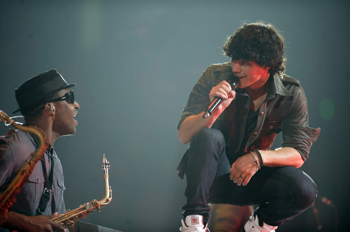 Joe Jonas and his brothers perform to the delight of thousands of young fans Aug. 4, 2009, during the Sacramento stop of the Jonas Brothers' 2009 World Tour at Arco Arena.