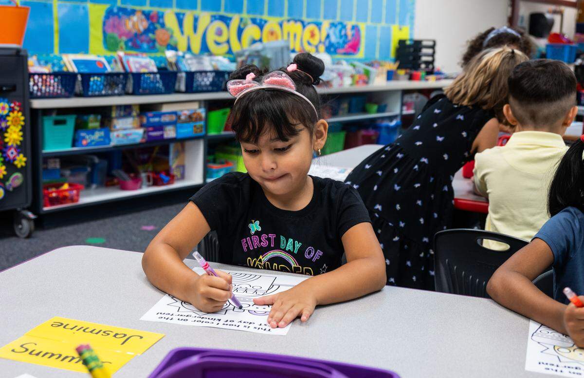 Kindergartener Jasmine Gonzalez, 5, colors in class on her first day of school at Riverview STEM Academy on Thursday, Aug. 7, 2025.