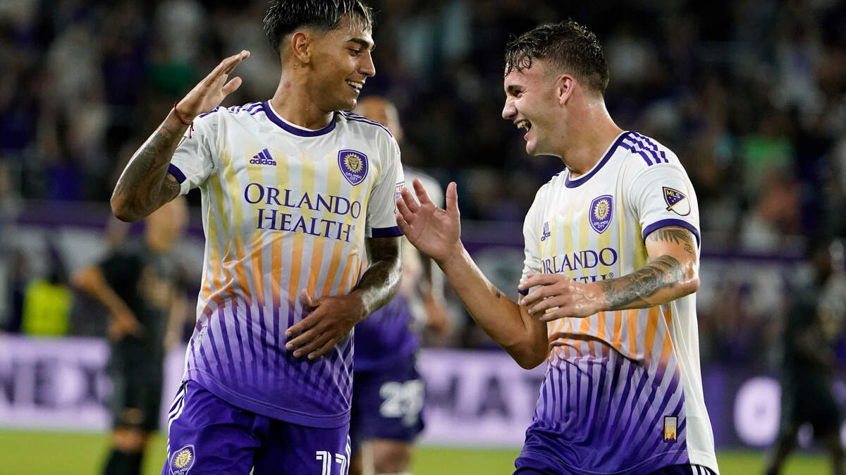 Orlando City’s Facundo Torres celebrates with Michael Halliday, right, after scoring a goal against Arsenal during the first half of an exhibition game Wednesday, July 20, 2022, in Orlando.