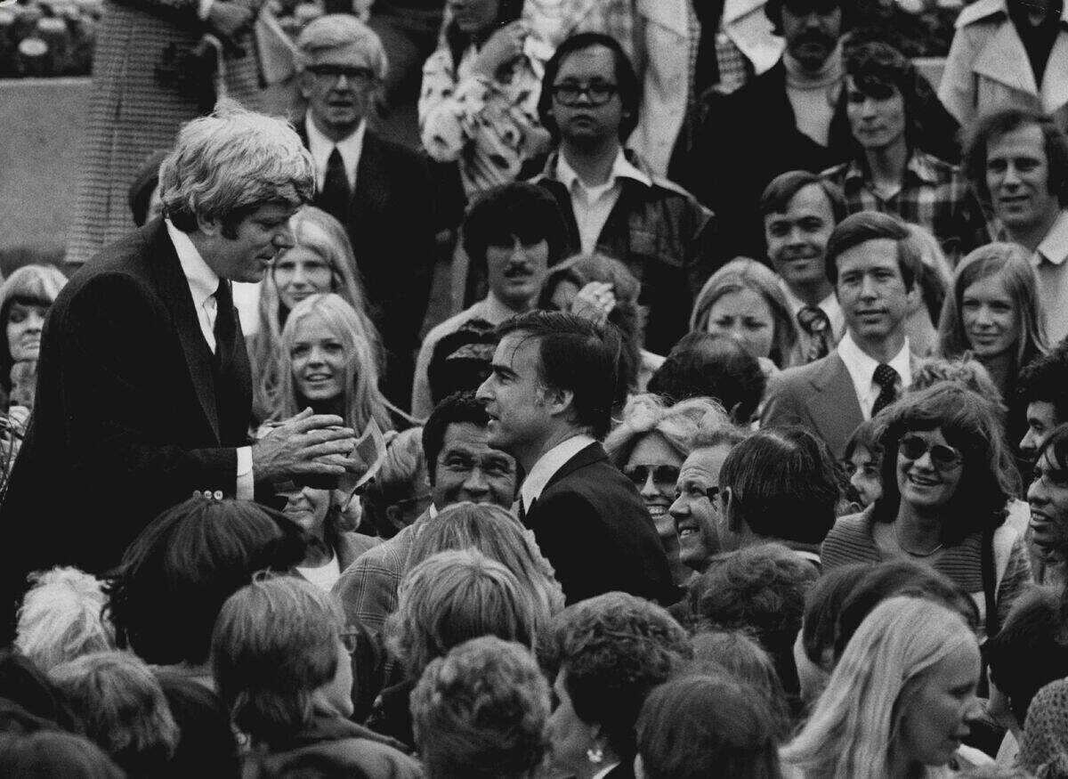 Television show host Phil Donahue talks with Gov. Edmund G. Jerry Brown amid the crowd after a taping session for the show on Sacramento’s K Street Mall on May 3, 1977. A notable face in the background is Gray Davis, who was Brown’s chief of staff at the time and was elected governor in 1998.