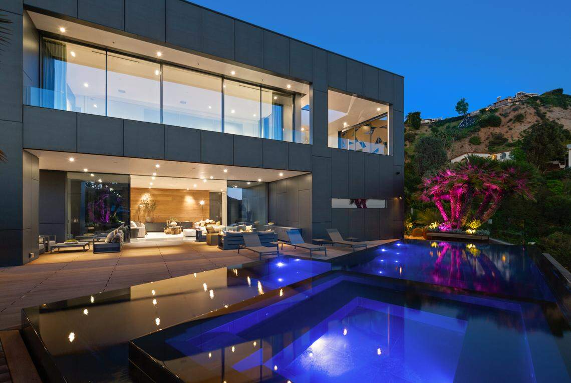 Built in 2017, the exterior of the house has a futuristic sort of appeal and glitters in the green hills of Beverly Hills, California. It’s listed for $13.995 million.