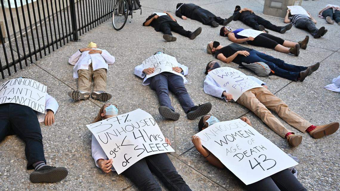 Protesters at the Sacramento County Administration Building in downtown Sacramento participate in a “die-in” on Tuesday, June 8, 2021, to bring attention to the end of the county health order on June 15 that prohibits clearing homeless encampments.