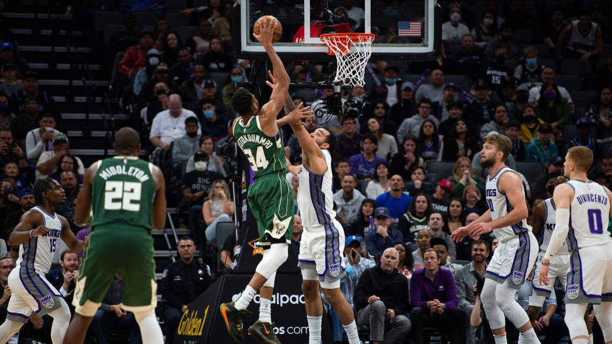 Milwaukee Bucks forward Giannis Antetokounmpo (34) shoots over Sacramento Kings forward Trey Lyles (41) during a game at the Golden 1 Center in Sacramento, Wednesday, March 16, 2022.