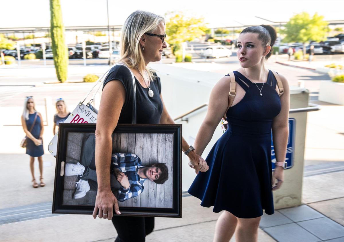 Laura Didier holds a photo of her 17-year-old son Zachary Didier on Thursday before entering Placer Superior Court in Roseville for the sentencing of Virgil Xavier Bordner, who sold Zachary a lethal dose of fentanyl.