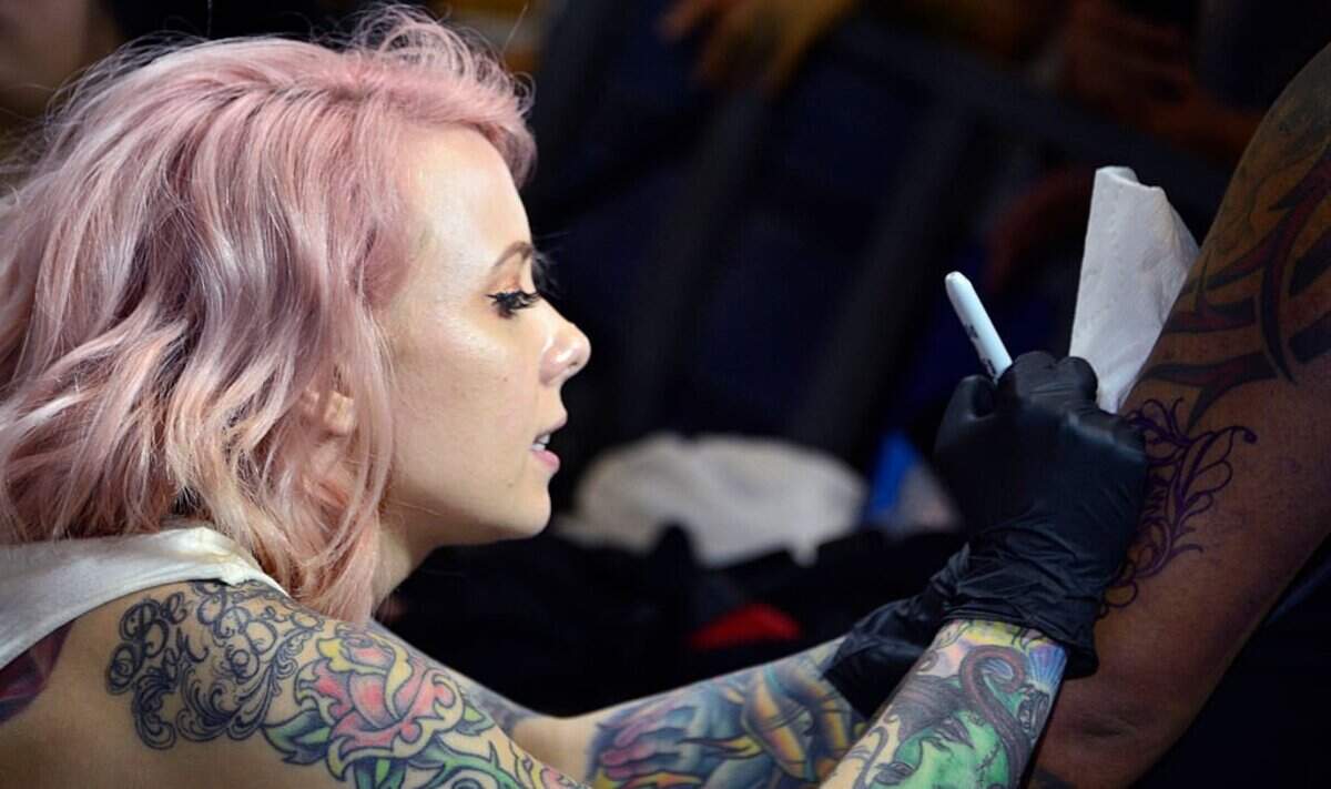 Tattoo artist Megan Massacre participates in the Fifth Edition of the Paradise Tatto International Convention in San Antonio de Belen, Costa Rica, on May 8, 2016.
