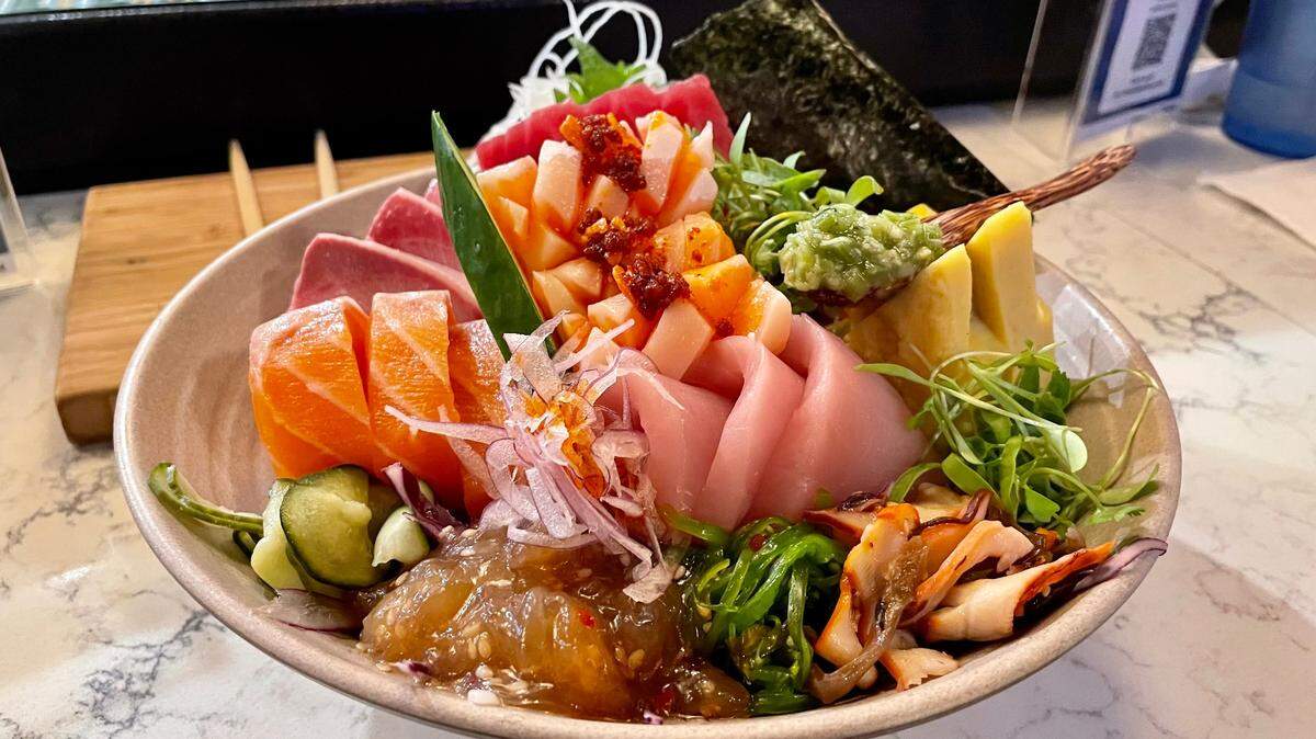 Sushi Q’s chirashi is a delicious bowl of chef-chosen fish that included escolar and salmon belly on a recent visit.
