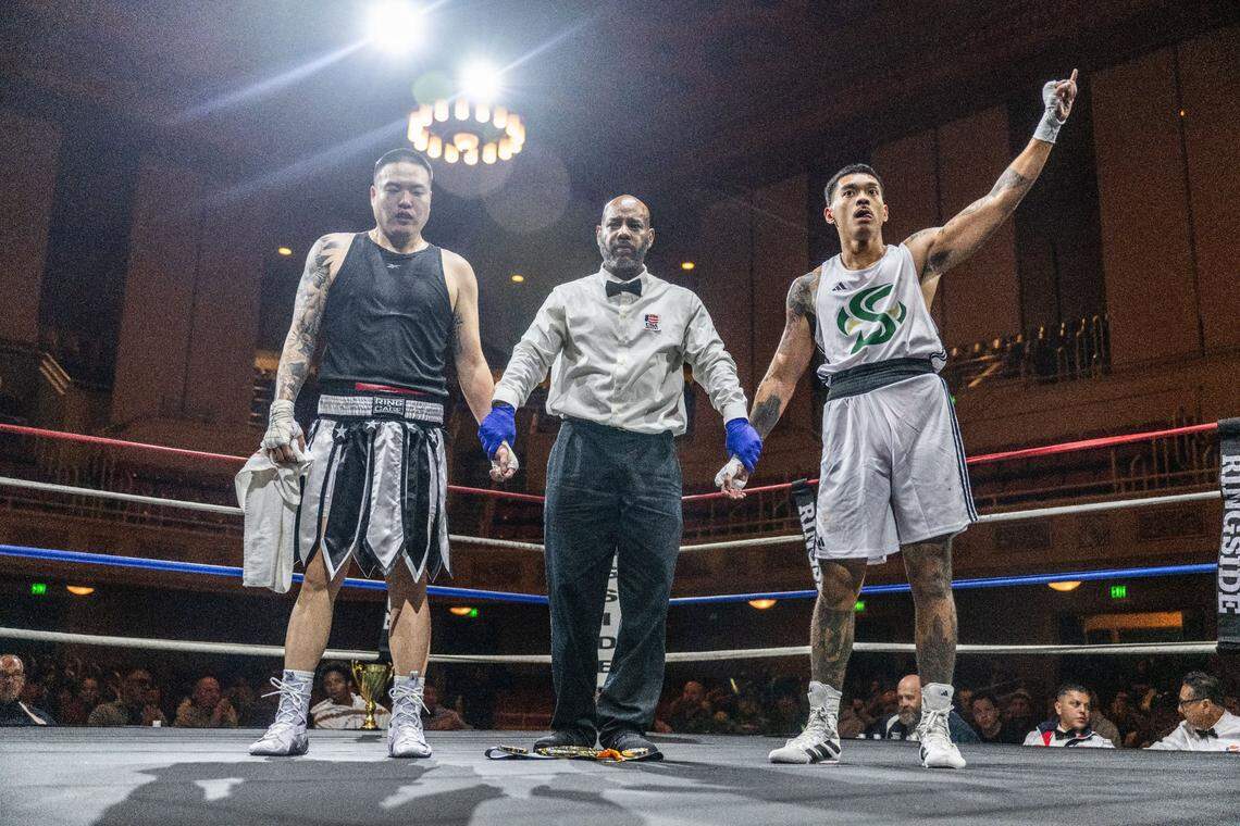 Neal Fumar of Sacramento State puts his index finger up before he was declared the winner of his fight against Kevin Shim of the Las Vegas Running Rebels during the Causeway Boxing Classic at Memorial Auditorium on Friday.