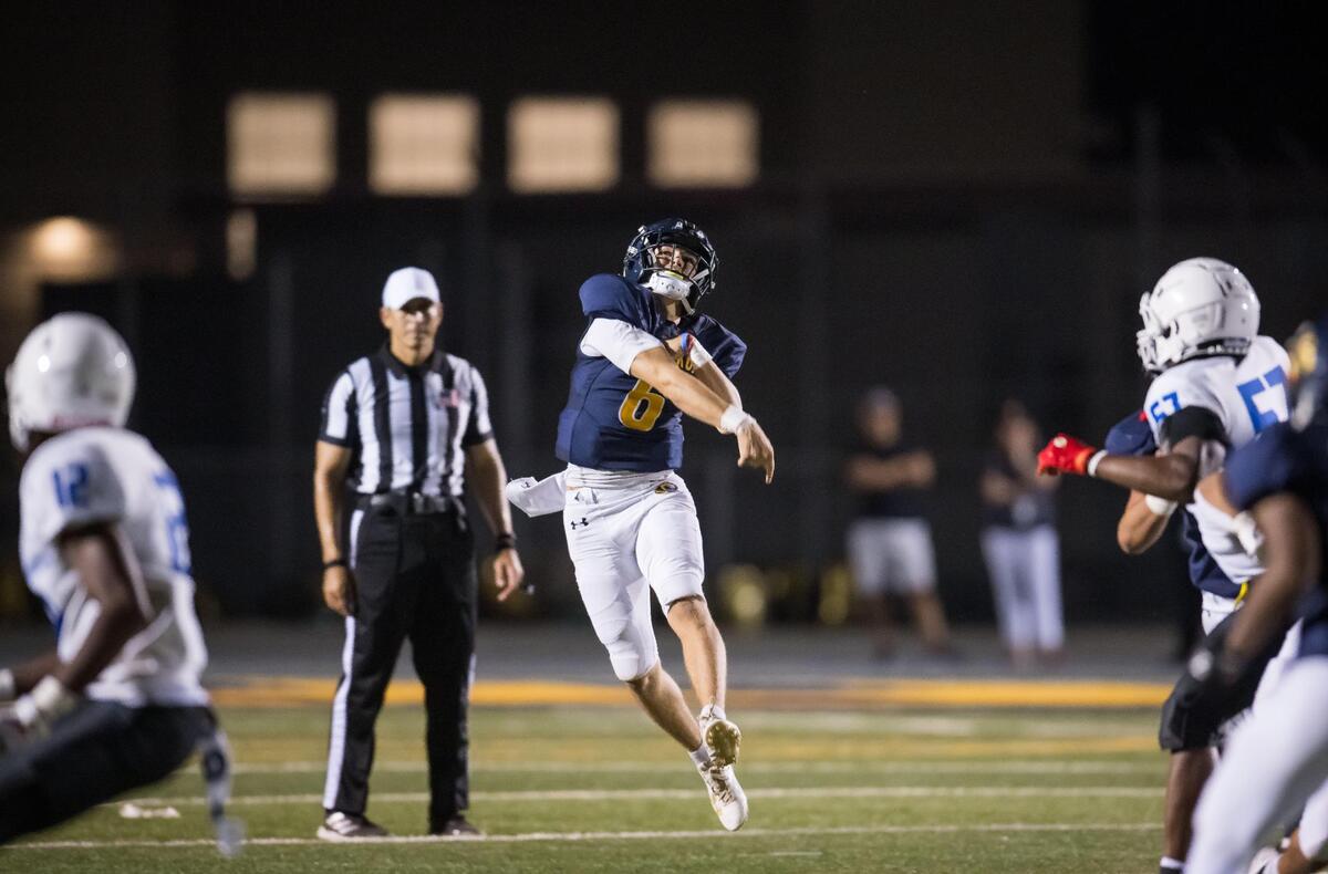 Inderkum Tigers quarterback Ricky Cole (6) launches the ball downfield for a complete touchdown reception to wide receiver Christian Harris (0) during the second quarter at the high school football game Thursday, Aug. 24, 2023, at Inderkum High School in Sacramento.
