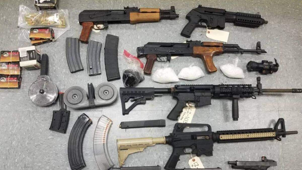 Guns, ammo and other contraband recovered from a search warrant served in Sacramento County.