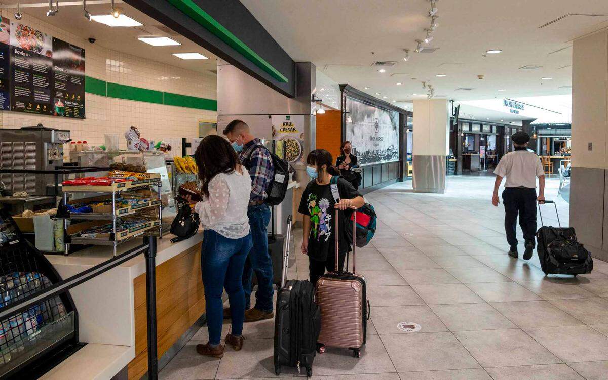 People purchase food in Terminal A in the Sacramento International Airport on Tuesday, October 26, 2021.
