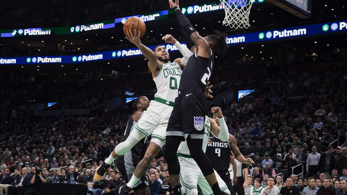 Boston Celtics’ Jayson Tatum goes to the basket against Sacramento Kings’ Richaun Holmes during the first quarter of an NBA basketball game Monday, Nov. 25, 2019, in Boston. (AP Photo/Winslow Townson)