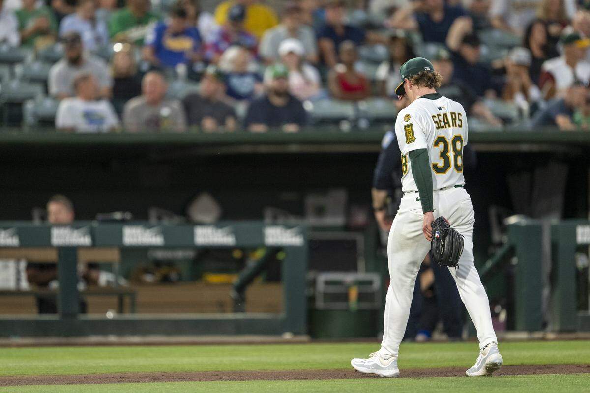 Athletics starting pitcher JP Sears (38) walks to the dugout during a pitching change in the fifth inning during a baseball game against the Seattle Mariners at Sutter Health Park in West Sacramento on Monday.