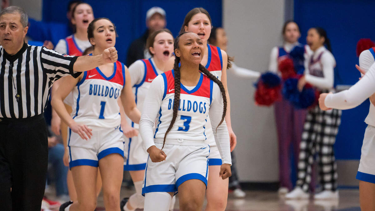 Folsom Bulldogs guard Breyana Kimmons (3) greets teammates with enthusiasm during a timeout in the fourth quarter as they play the Salesian (Richmond) Pride in the CIF Northern California Open Division high school girls basketball first round playoff game Wednesday, March 1, 2023, at Folsom High School. Folsom lost to Salesian in double overtime.