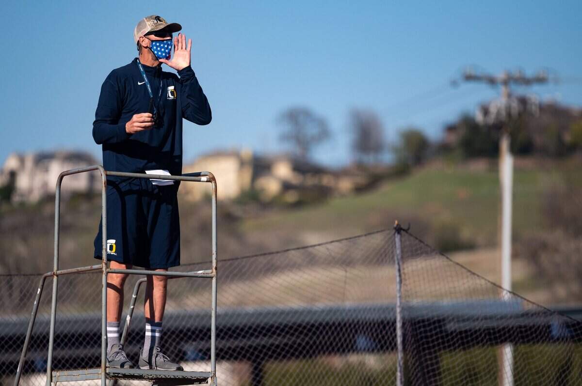 Oak Ridge High School football head coach Eric Cavaliere shouts directions during a team practice Thursday, March 4, 2021, on their home field in El Dorado Hills.