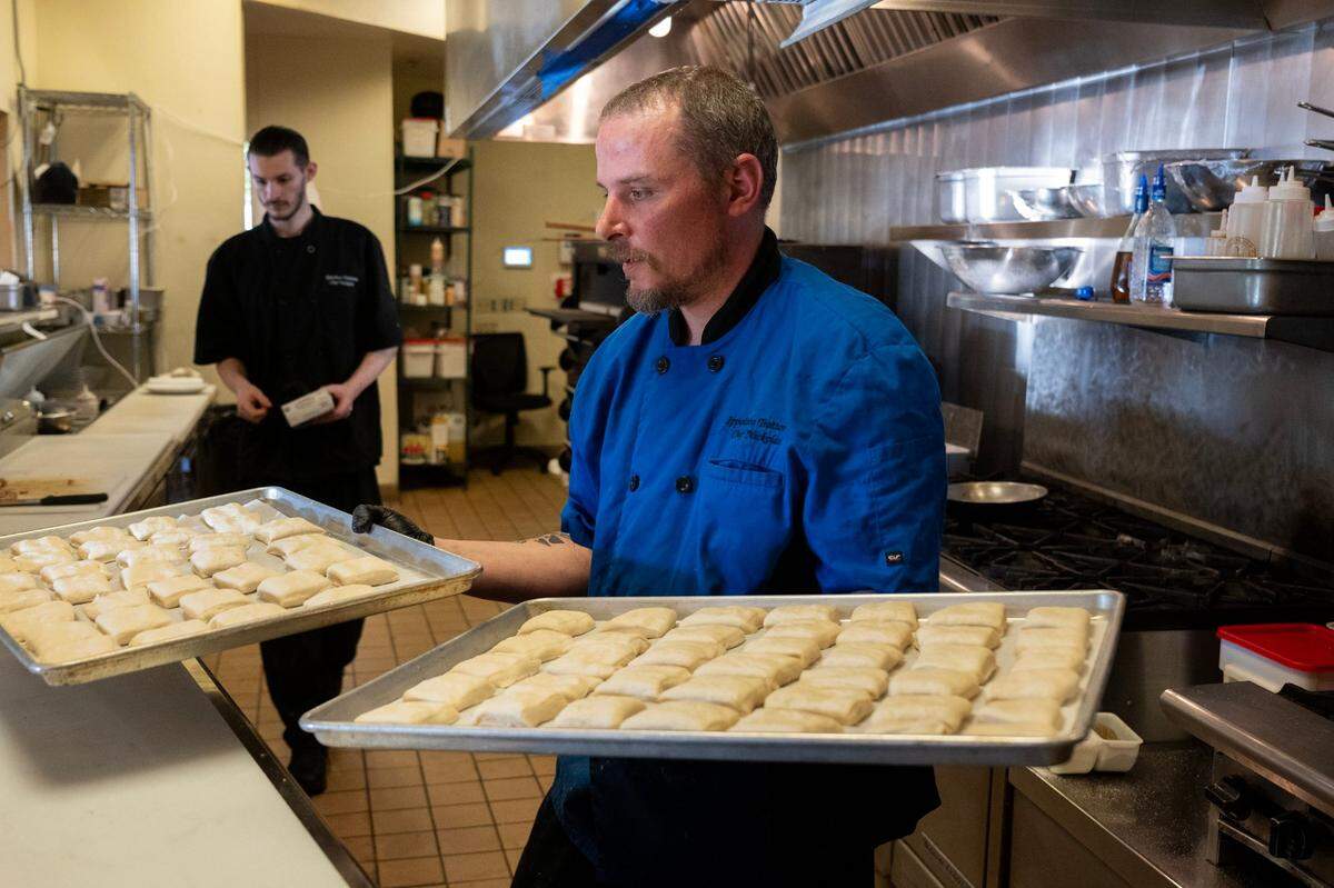 Chef Nickolas Ippolito prepares to bake fresh bread in the kitchen of Ippolito’s Trattoria in Rosemont earlier this month.