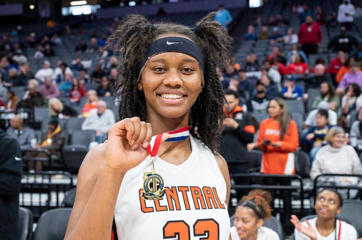 Central Grizzlies forward Talia Maxwell (23) poses with her sportsmanship medal after winning the CIF State Division II Girls Basketball Championships against the Bonita Vista Barons on Saturday, March 11, 2023, at Golden 1 Center in Sacramento. The Grizzlies defeated the Barons 52-41.