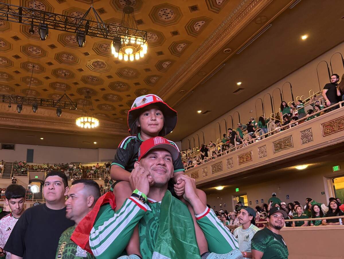 Ernesto Arizaga waits with his goddaughter, Elyze Ramirez, for the World Cup match between Mexico and Ecuador to start at the Sacramento Republic FC’s watch party at Sacramento Memorial Auditorium on Tuesday, June 30, 2026.