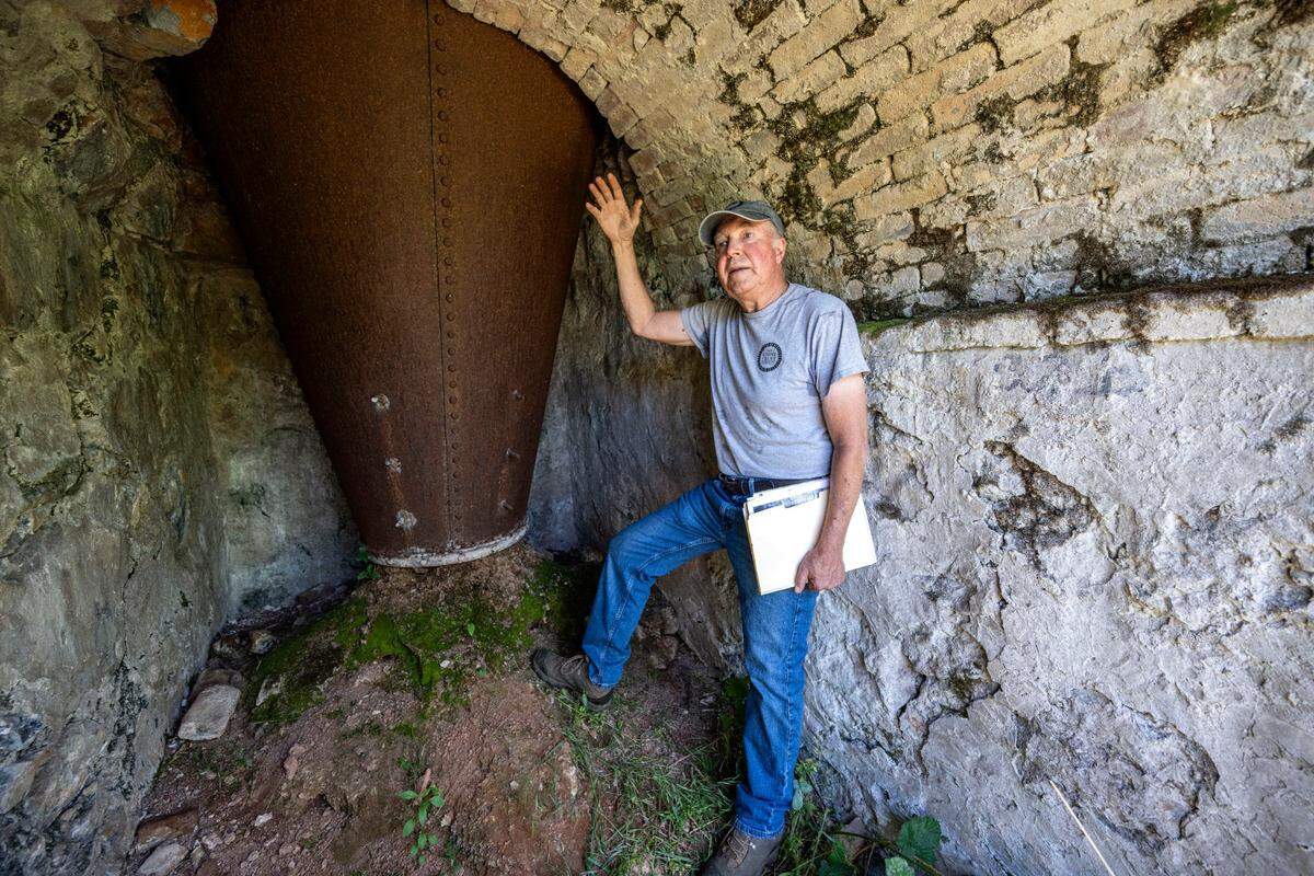 Jim Wood, a board member with the nonprofit Colfax Lime Kiln Preserve, stands last month inside a historic lime kiln that was rediscovered after a 2021 wildfire in Placer County.