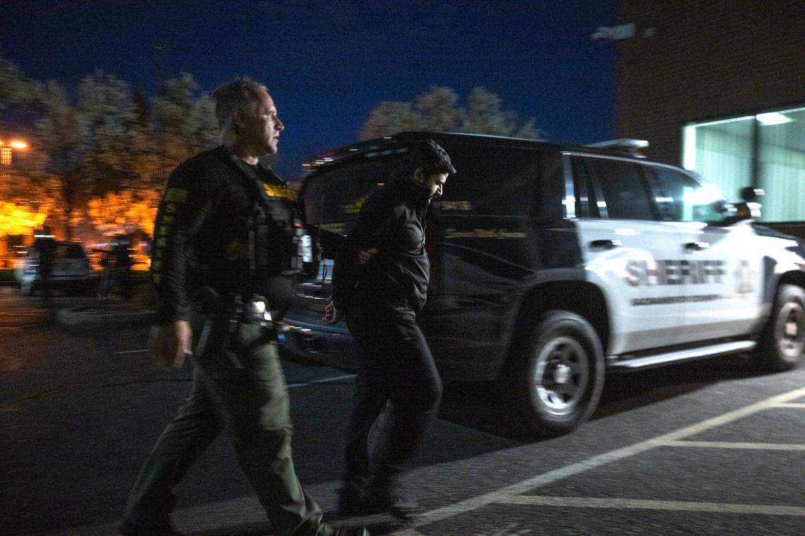 A Sacramento Sheriff’s deputy escorts a man who was arrested for propositioning a deputy posing as prostitute on Watt Avenue in North Highlands on Friday. Deputies made 53 arrests during the operation.